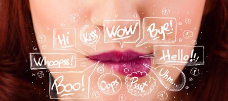 Beautiful red lips with white speech bubbles close up