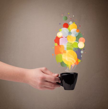 tea-cup-colorful-speech-bubbles-close-160154921 Tea cup with colorful speech bubbles, close up
