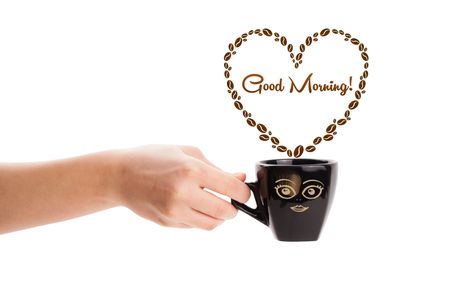 Coffee mug with coffee beans shaped heart with good morning sign, isolated on white