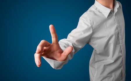 Young businessman pressing imaginary button