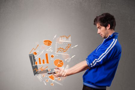 Handsome young man holding laptop with graphs and statistics