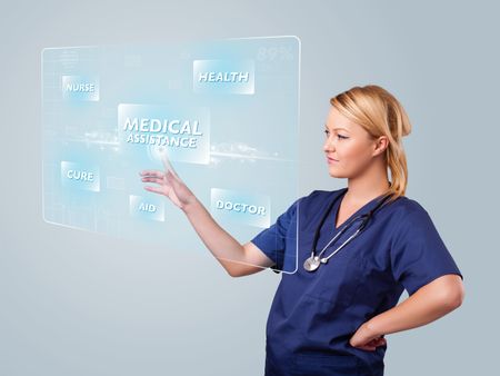 Young nurse standing and pressing modern medical type of buttons