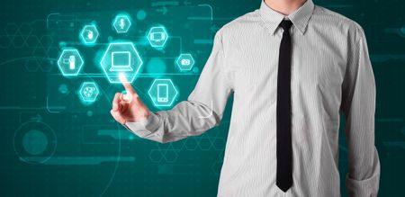 Young businessman pressing virtual media type of buttons