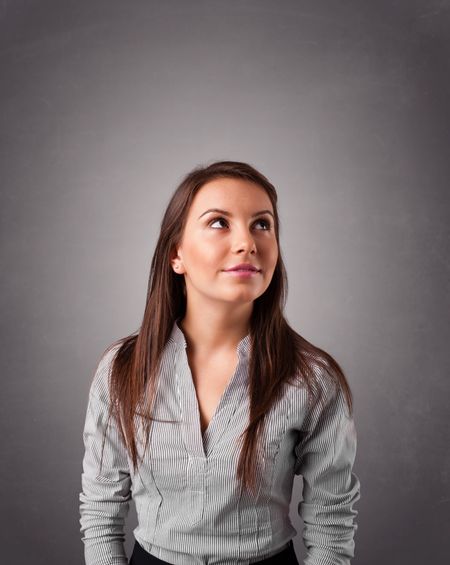 beautiful-young-woman-standing-thinking-copy-160159778 Beautiful young woman standing and thinking with copy space
