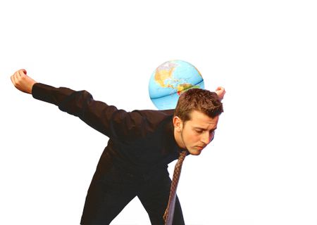Business Man balancing the world
