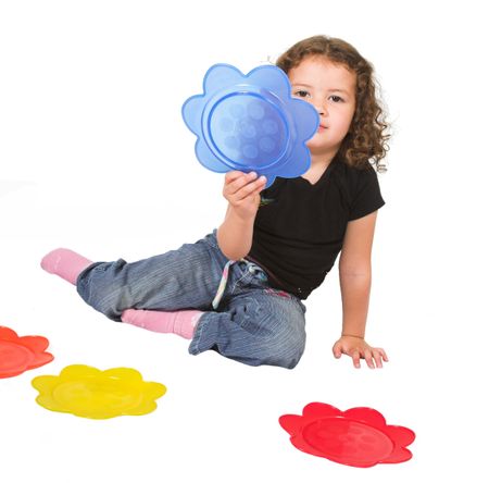 little kid making her colour choice over a white background