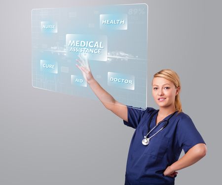 Young nurse standing and pressing modern medical type of buttons