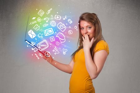 Beautiful young woman holding notebook with colorful hand drawn multimedia icons