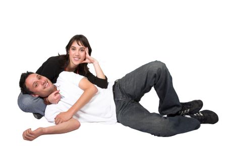 casual couple on the floorover a white background