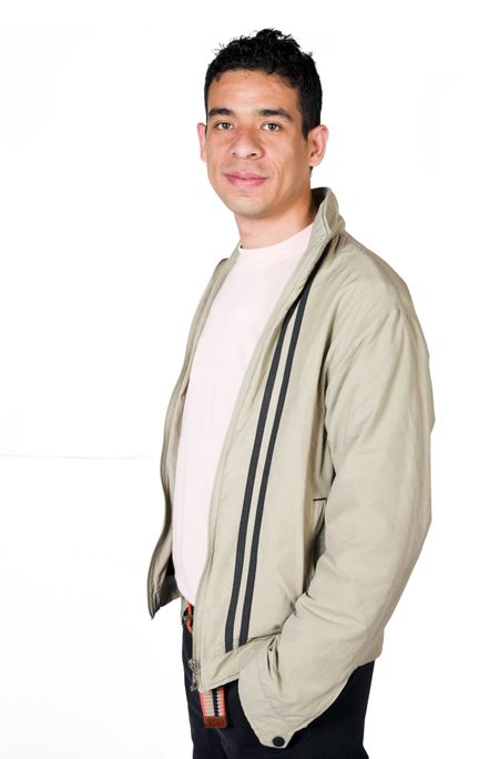 casual latin american man over a white background
