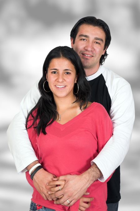 happy casual couple with a monochrome backdrop