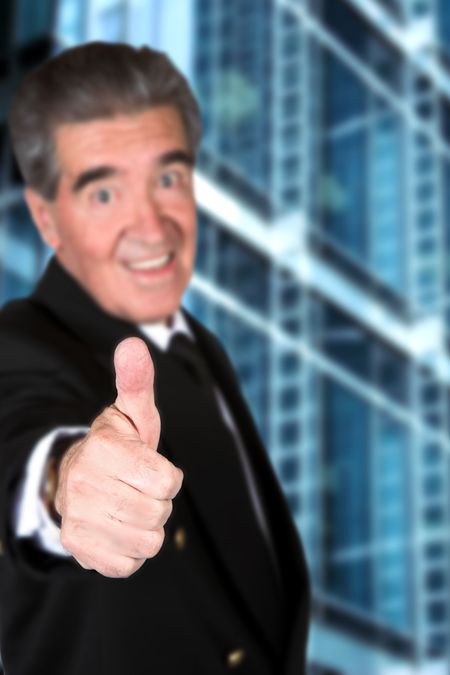 business man thumbs up in a corporate environment