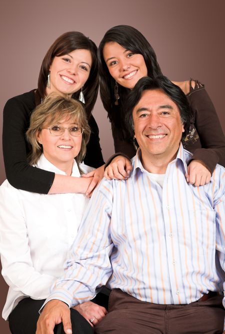 happy latin american family over a brown background