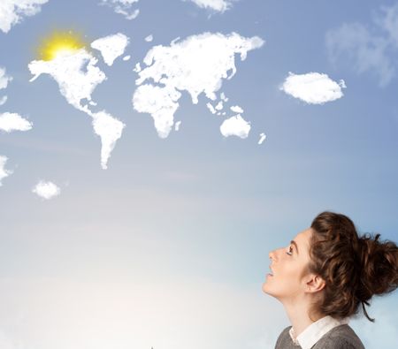 Young casual girl looking at world clouds and sun on blue sky