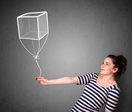 Pretty young woman holding a drawn cube balloon
