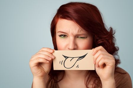 pretty-young-girl-holding-white-card-163176653 Pretty young girl holding white card with smile drawing on gradient background