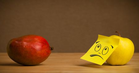 Apple with post-it note communicating with mango