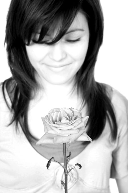 black and white teen portrait with a flower