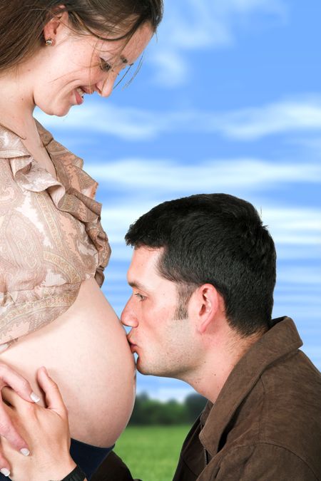 dad kissing mums belly - including clipping path to easily change the background