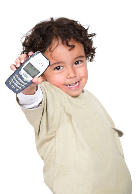 cute boy with a mobile phone over a white background