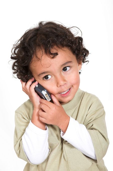 cute kid talking on a cell phone over a white background