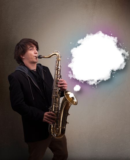 Handsome young man playing on saxophone with copy space in white cloud