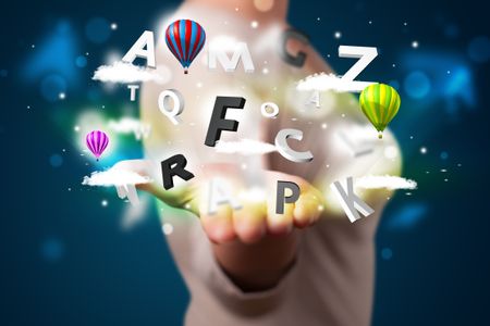 Young beautiful woman presenting magical abstract clouds and balloons concept