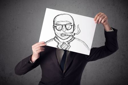 Businessman holding a cardboard with a smoking man on it in front of his head