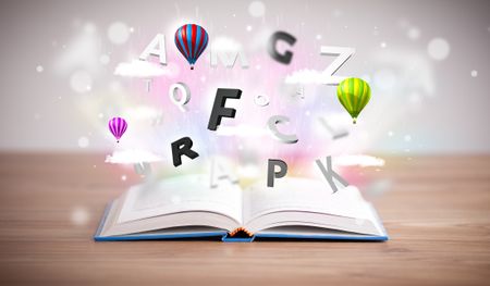 Open book with flying 3d letters on concrete background. Colorful education concept