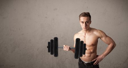 Strong muscular man lifting weights