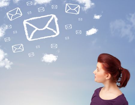 Casual young girl looking at mail symbol clouds on blue sky