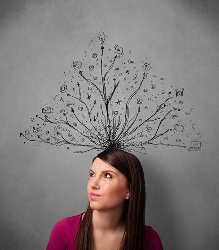 Pretty young woman thinking with tangled lines coming out of her head