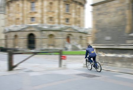 Student Cycling around (outside) Oxford University