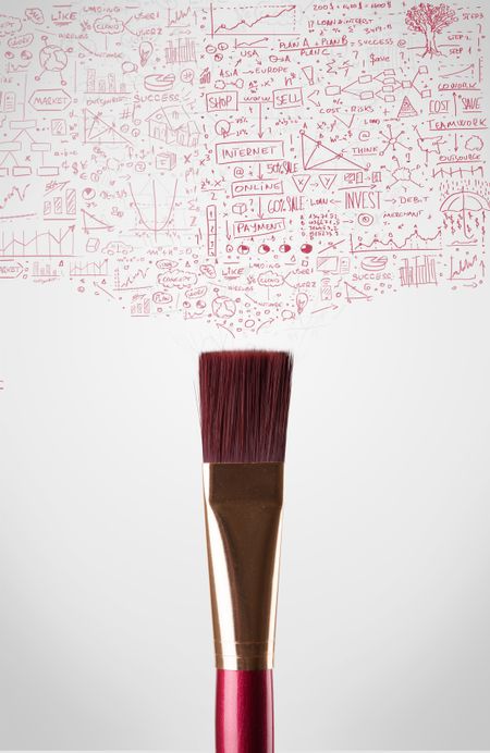 Paintbrush close-up with sketchy diagrams