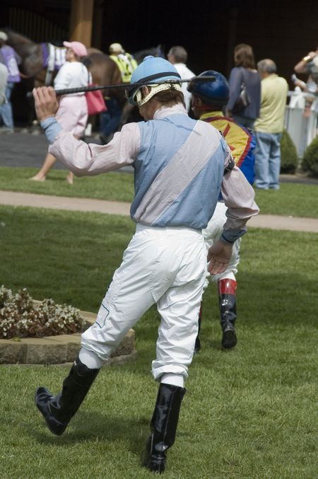Jockey raising whip before a race