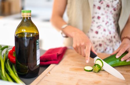 Multi-ethnic girl preparing food in the kitchen