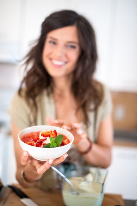 Multi-ethnic girl preparing food in the kitchen