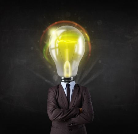 Business man with idea light bulb head concept