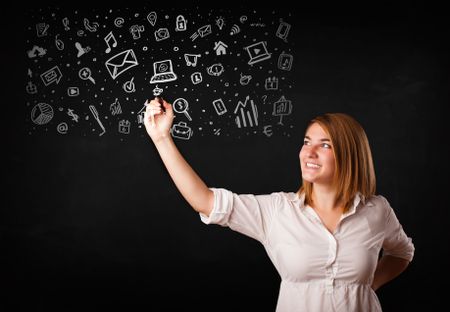 Young woman drawing and sketching icons and symbols on white background
