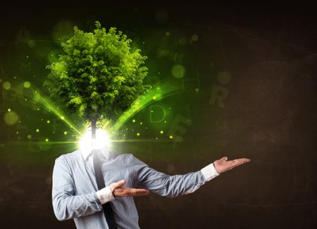 Man with green tree head concept on brown background