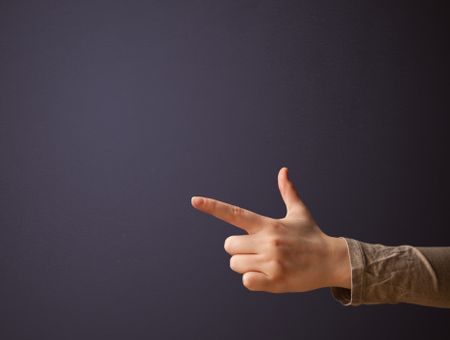 Gun shaped woman hand with empty space