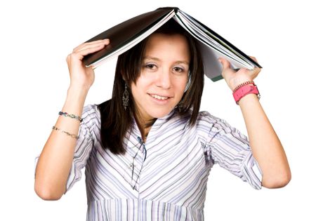 female student with book on head over white