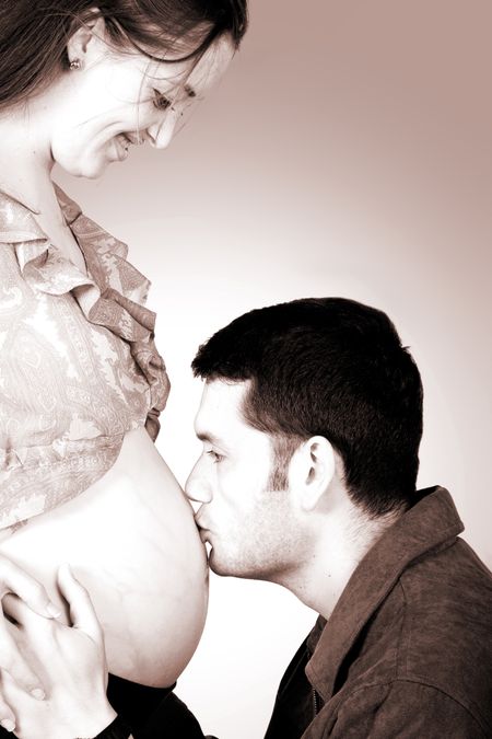 dad kissing mums belly - including clipping path to easily change the background