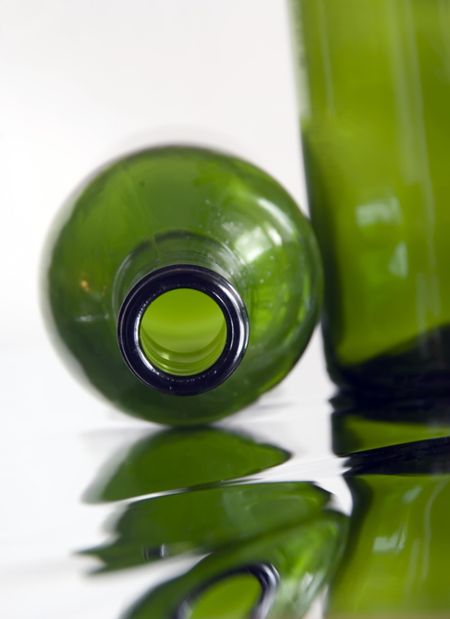 Wine bottles on reflective surface