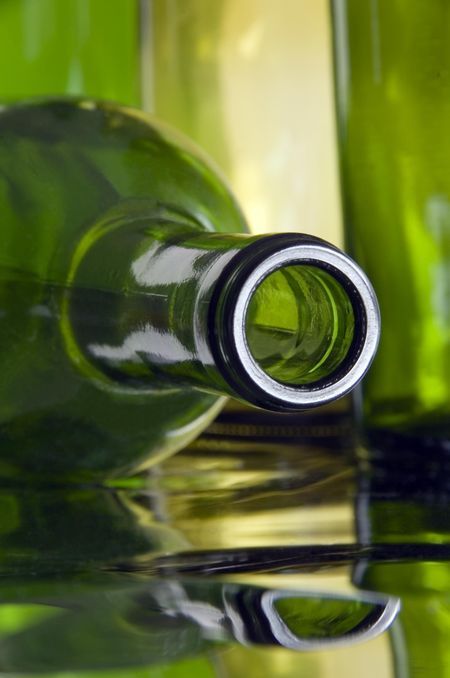 Top of wine bottle on reflective surface