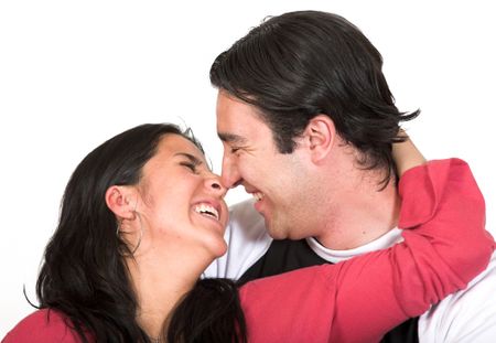 beautiul couple smiling at each other over white