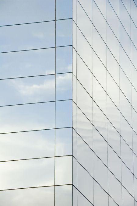 Reflection of morning sky in windows of high-rise on college campus