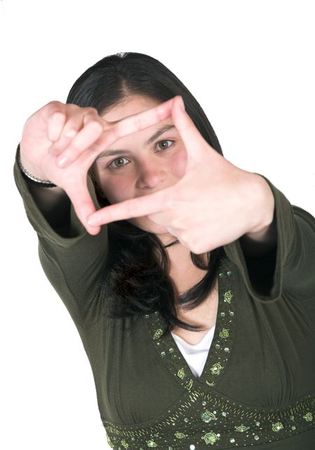 girl looking through a handframe over white