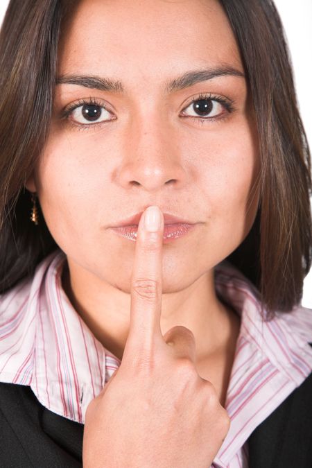 Business woman with finger on her mouth