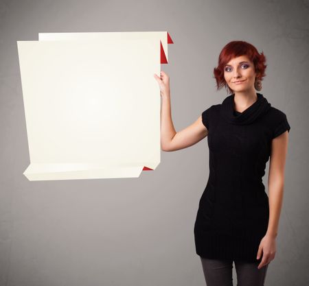 Baeutiful young woman holding white origami paper copy space